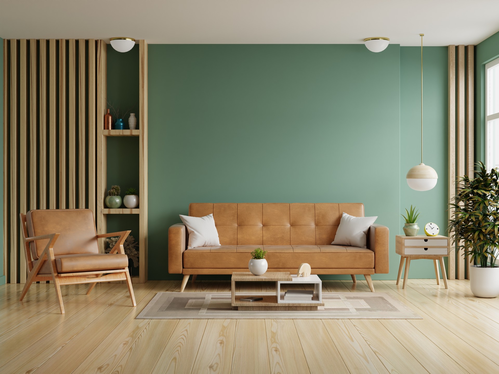 Sala de estar con sofá de cuero y sillón de cuero sobre fondo de pared verde oscuro vacío.